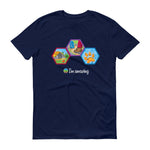 Yellow dome tent and campfire, hiking boot and backpack on trail and dog paw print hexagons on navy blue tshirt