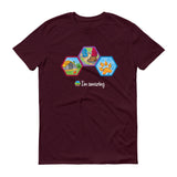 Yellow dome tent and campfire, hiking boot and backpack on trail and dog paw print hexagons on maroon tshirt
